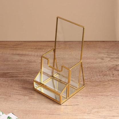 Brochure Holder with a polished glass frame and angled trifold structure displayed in a clean tabletop setting