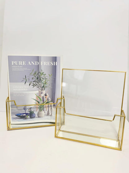 Elegant Glass Brochure Holder with sleek gold frame on a tabletop for versatile, stylish and durable display use