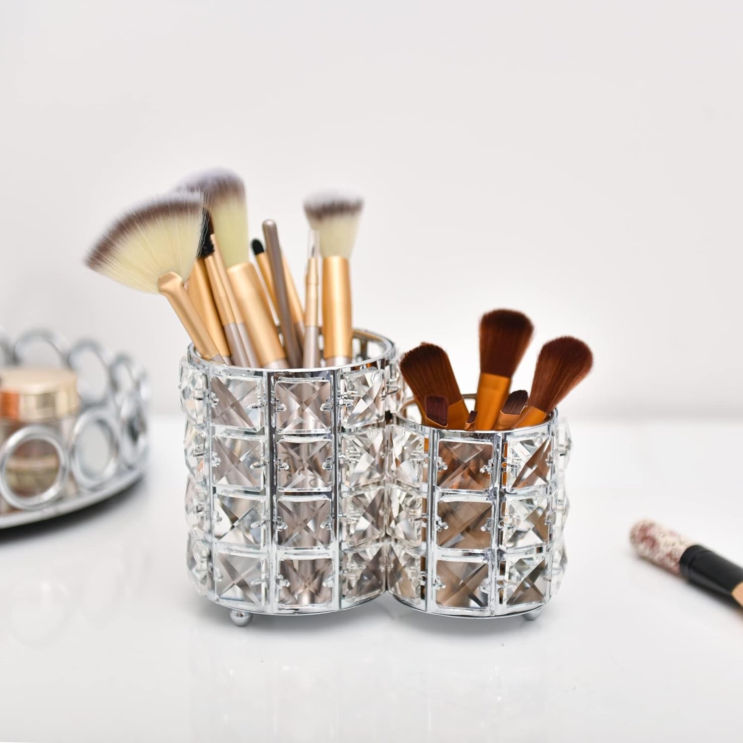 Silver Crystal Makeup Brush Holder with multiple compartments for organized storage of various makeup brushes
