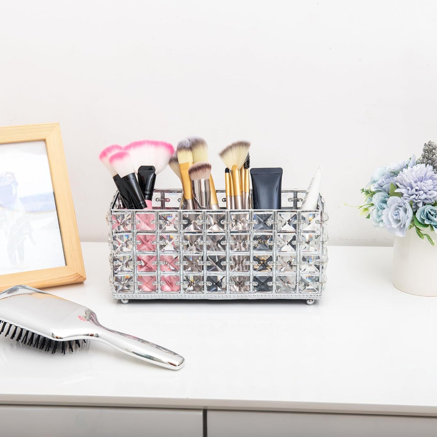 Elegant Crystal Brush Organizer with three compartments storing makeup brushes on a cabinet for quick and neat organization