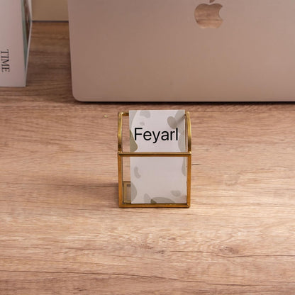 Clear Glass Business Card Holder with gold edge on a desk, adding a refined touch to the workspace