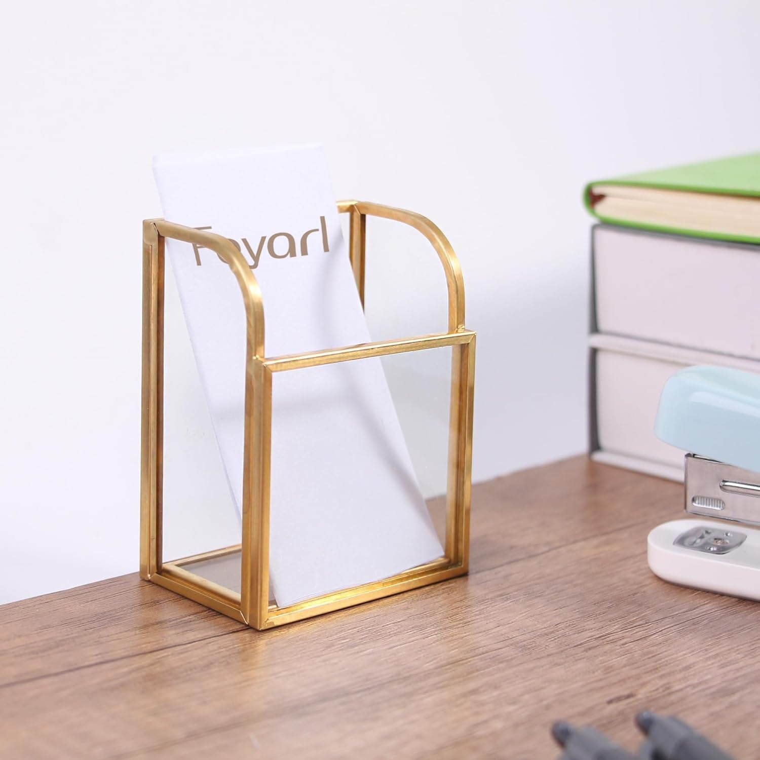 Clear Glass Business Card Holder with gold edge on a desktop, adding a refined touch to office organization