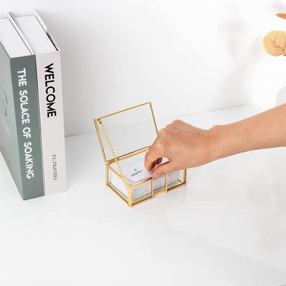 Elegant Clear Glass Business Card Holder with gold edge, hand taking a name card for easy access