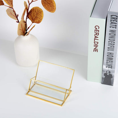 Clear Glass Business Card Holder with gold edge displayed on a desk, highlighting an elegant and modern workspace accessory