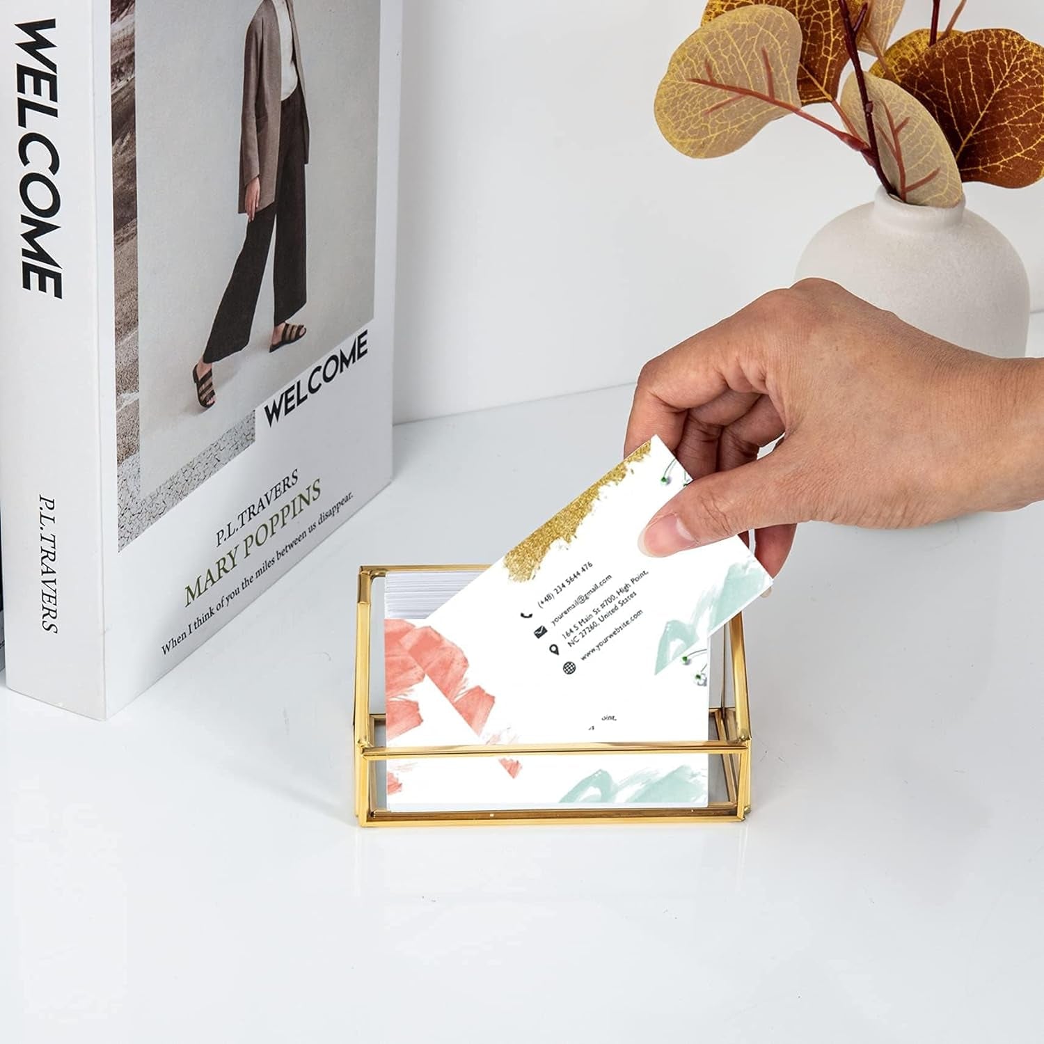 Elegant Business Card Holder displayed on an office desk with a hand reaching for a card