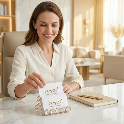 Feyarl Crystal Business Card Holder Stand on a Desktop with a Hand Picking Up a Business Card for Convenient Access