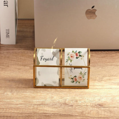 Glass Business Card Holder with gold edge displaying business cards on a desktop workspace
