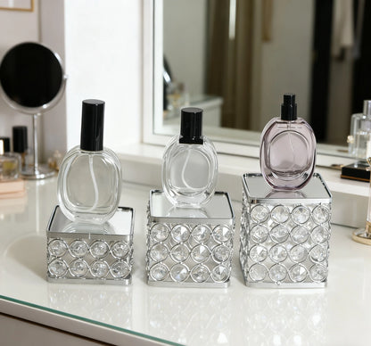 Display Stand Set with three different heights, mirrored surfaces, and elegant crystal accents