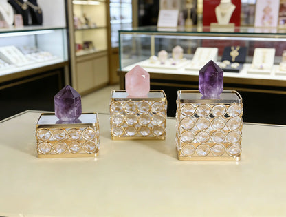 Crystal Display Pedestal showcasing crystal pieces with a refined mirrored surface and sparkling bead accents