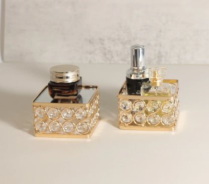 Display Pedestal with cosmetics arranged on its mirrored platform for a refined vanity display