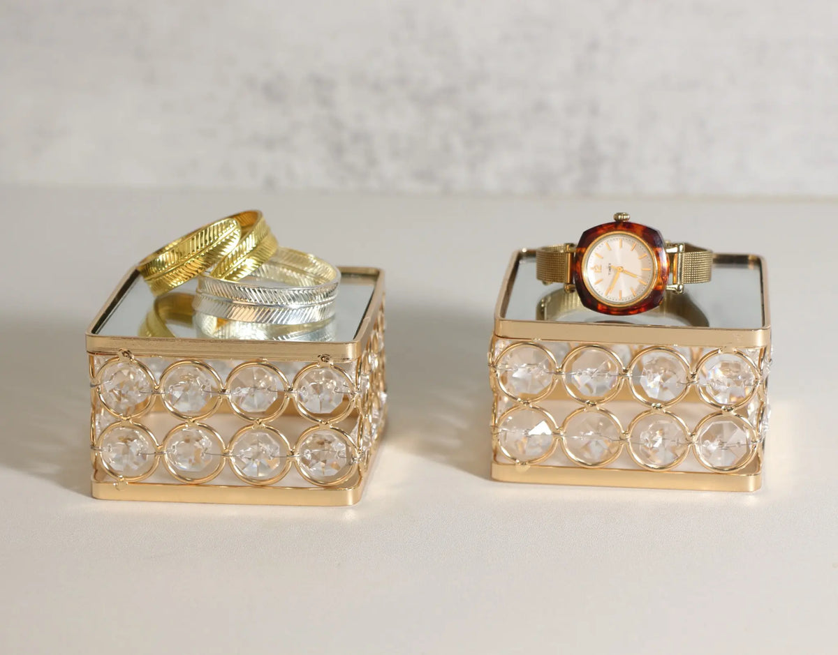 Feyarl Display Stand Set featuring a raised platform design with reflective mirror surfaces and crystal accents