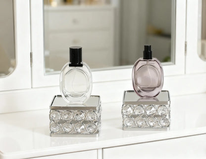 Feyarl Crystal Display Stand Set with two square risers featuring mirrored bases and sparkling crystal bead details