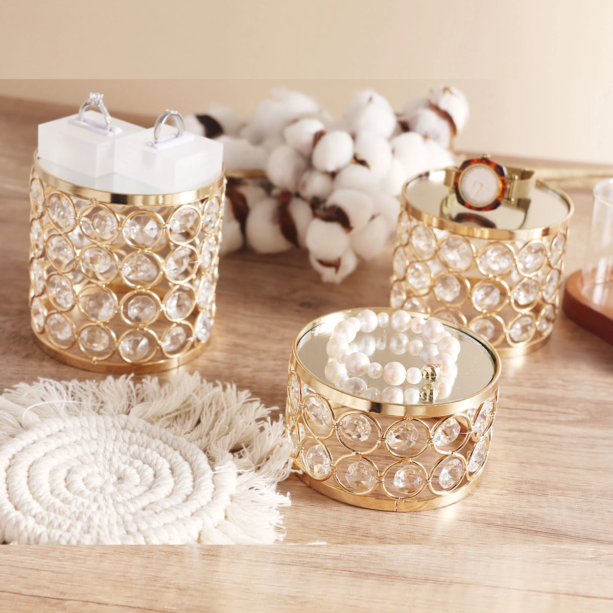 Gold Crystal Display Risers with jewelry arranged at three height levels for a layered display