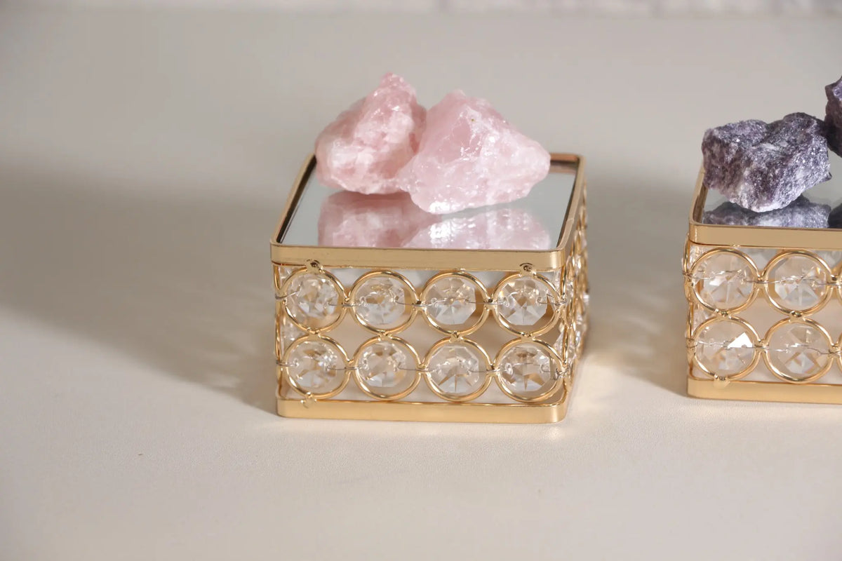 Crystal Display Pedestal holding crystal pieces with mirrored reflections and sparkling bead details