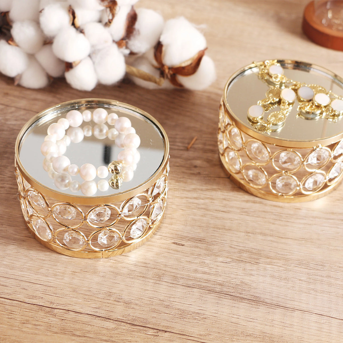 Crystal Display Stand arranged with small ornaments on a tabletop to create an elegant decorative display