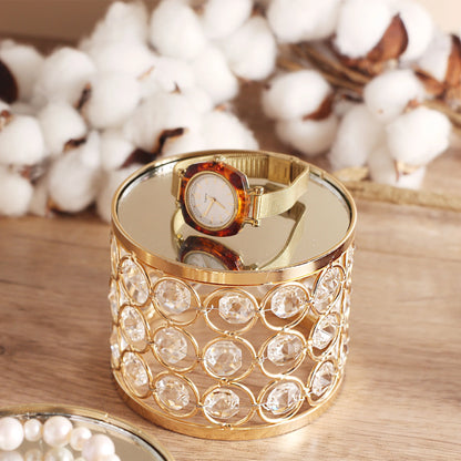 Elegant Gold Crystal Display Stand arranged with a watch, featuring a mirrored base that enhances its reflective beauty