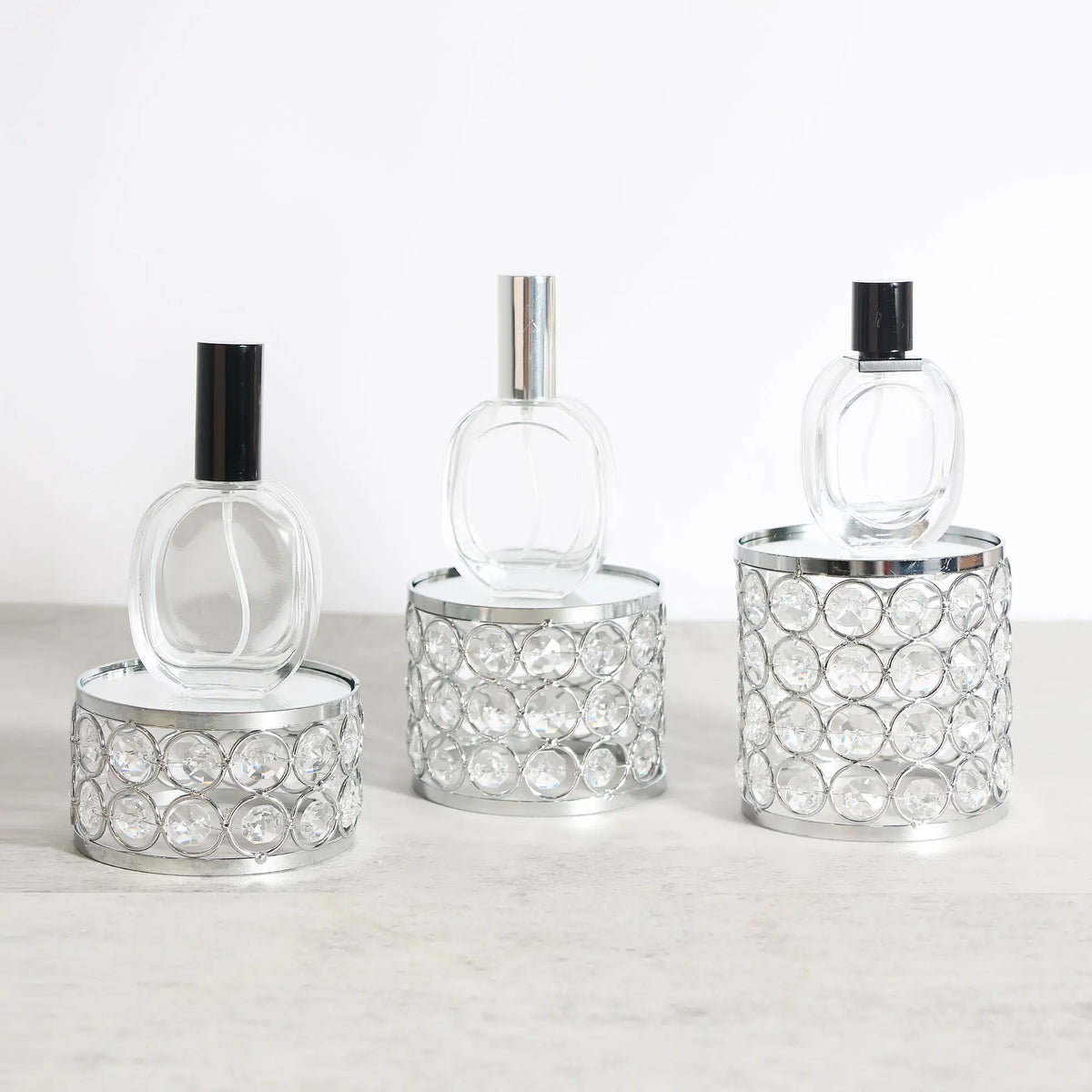 Elegant Crystal Display Riser styled with small perfume bottles