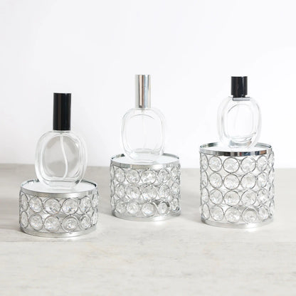 Elegant Crystal Display Riser styled with small perfume bottles