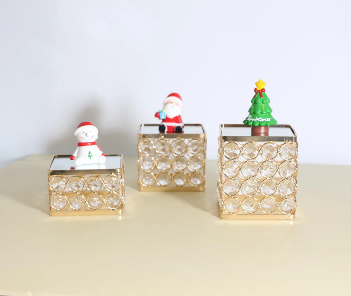 Display Pedestal enhancing small decorative pieces with an elevated display design and elegant reflective finish