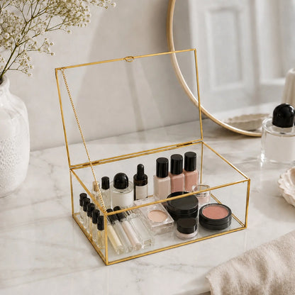Gold Glass Keepsake Box displaying cosmetics on a tabletop with an elegant decorative style
