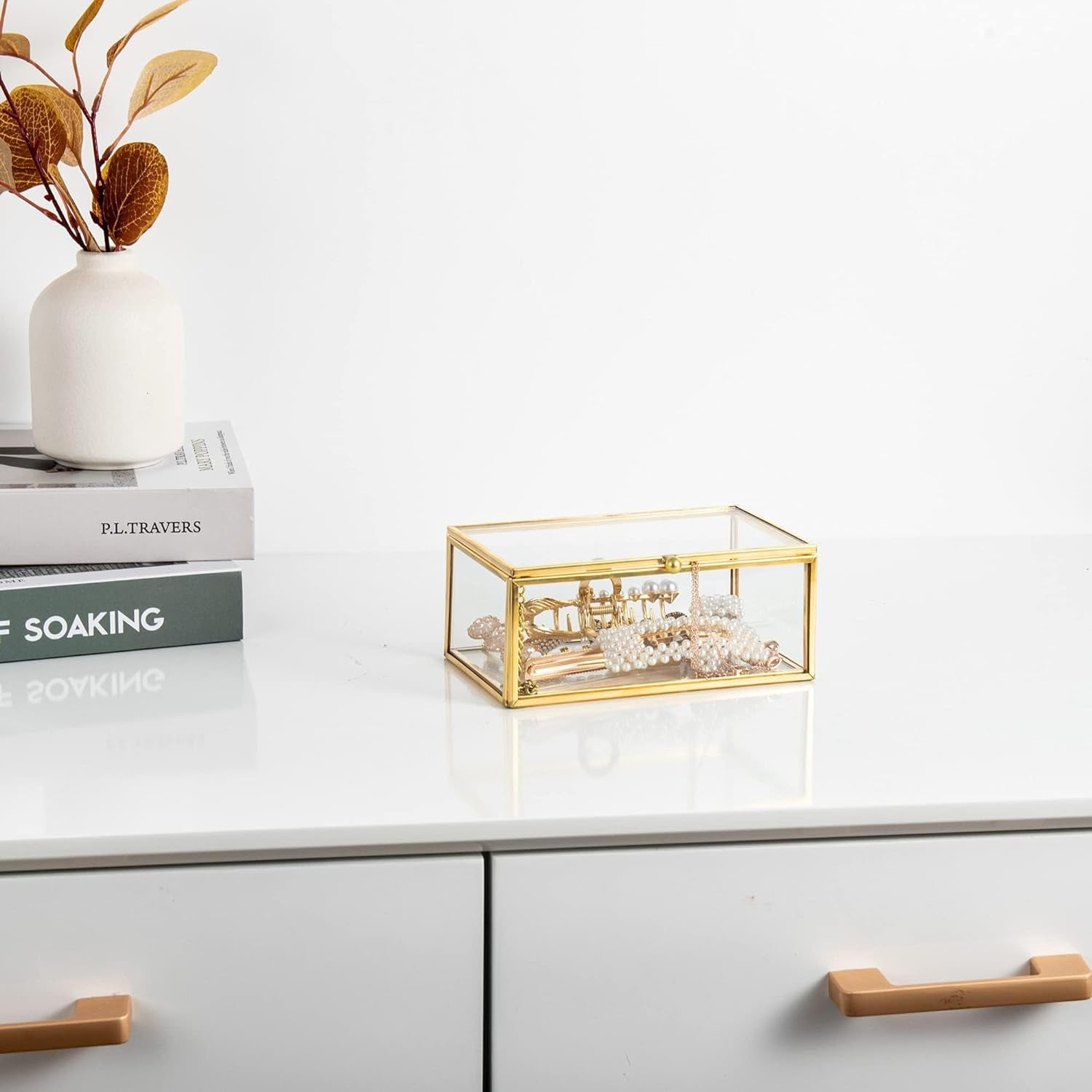 Gold Glass Organizer Box storing jewelry and small accessories on a cabinet for easy access and organized storage