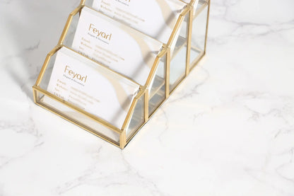 Detailed Look at the Glass Display Stand with Gold Frame Accents and Clean Contemporary Construction