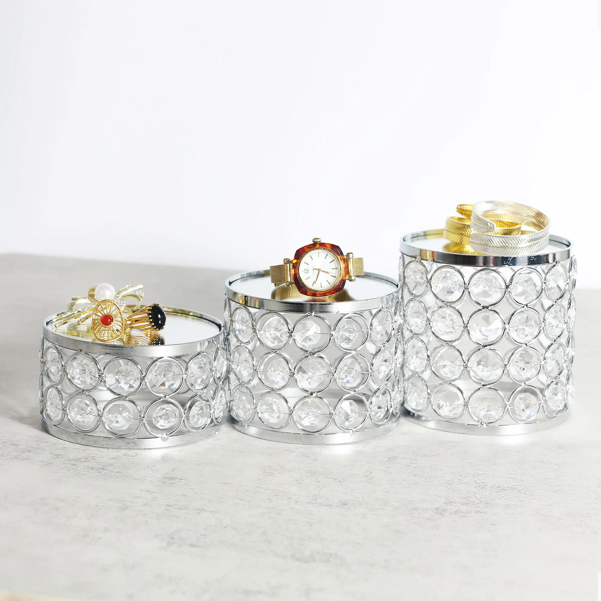 Refined Crystal Display Riser elevating watch and accessory displays with mirrored surfaces and elegant design
