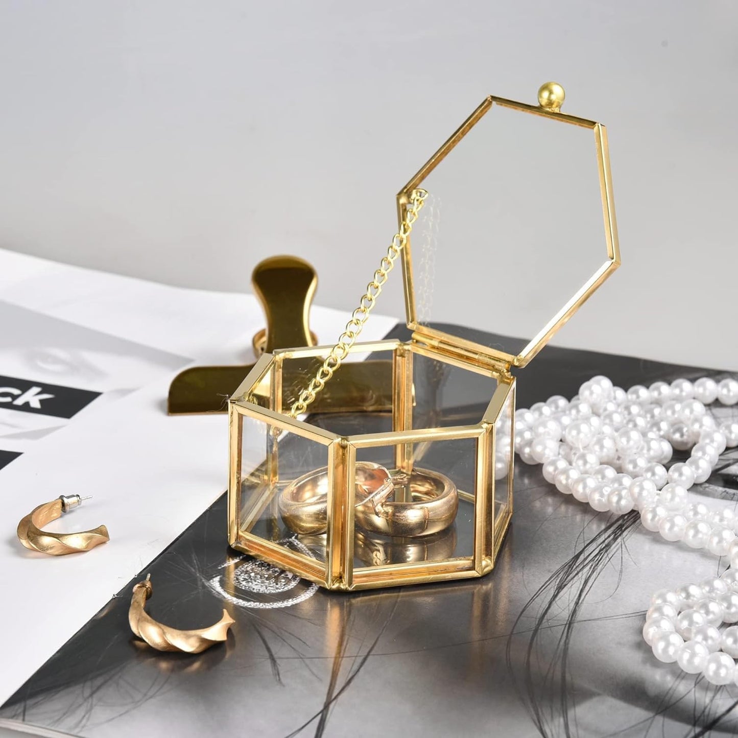 Gold Glass Jewelry Box close-up featuring a chain-linked lid design that adds elegance and decorative appeal