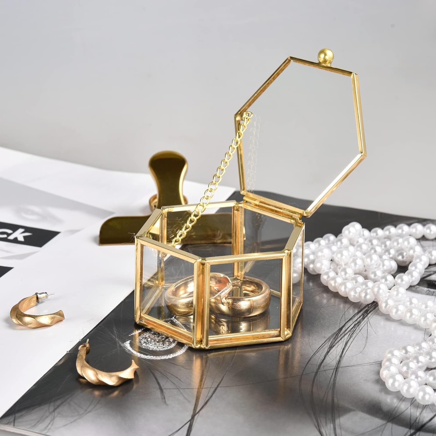Gold Glass Jewelry Box close-up featuring a chain-linked lid design that adds elegance and decorative appeal