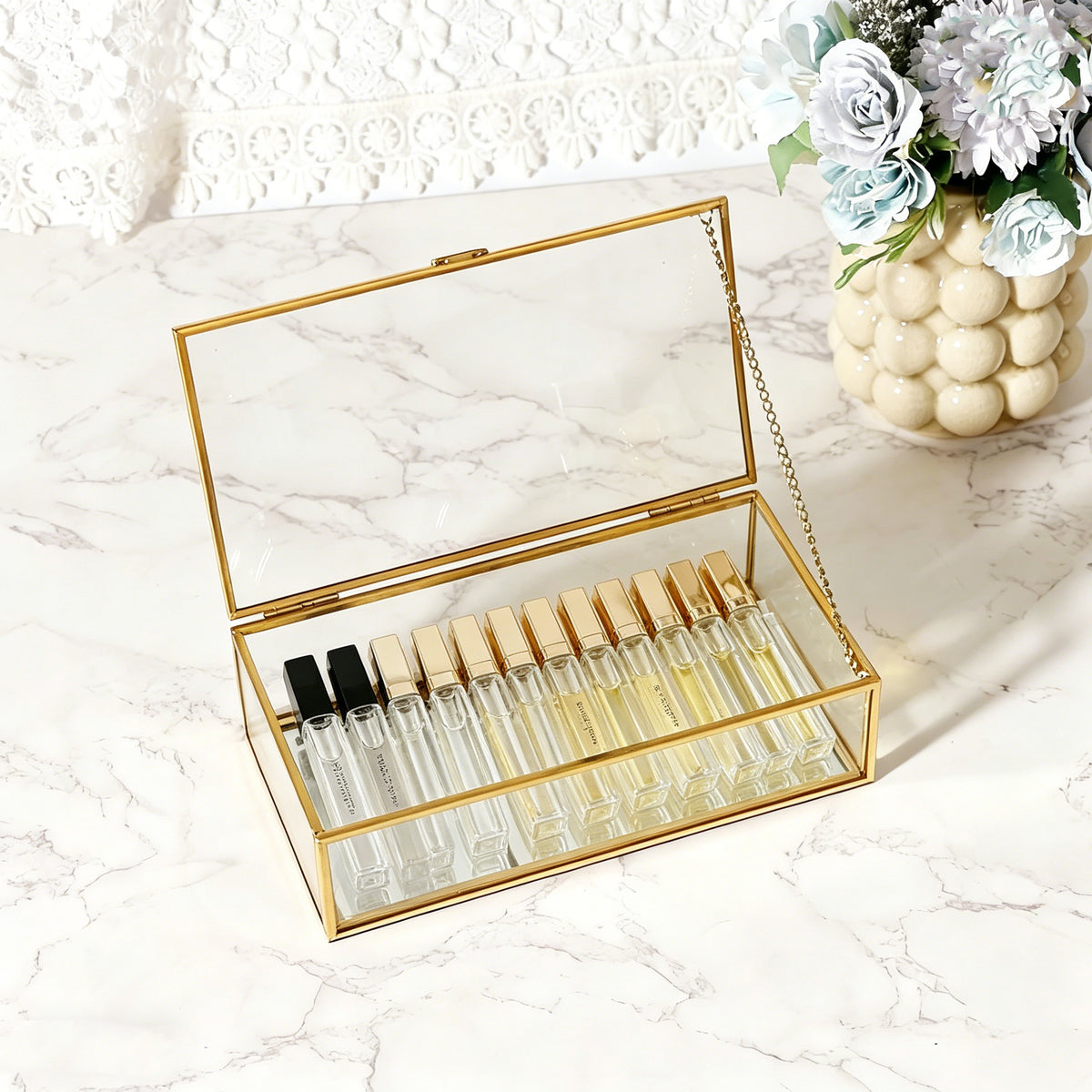 Gold Glass Jewelry Box with Perfume Bottles Creating a Stylish Display for Small Treasures and Decorative Items