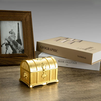 Compact Vintage Jewelry Box displayed on a tabletop with an engraved gold exterior adding elegant charm to home decor