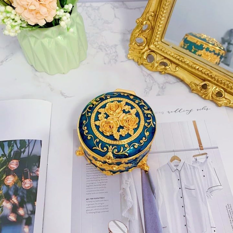 Elegant Blue Trinket Box showcasing a top view with intricate floral and leaf engravings on the lid