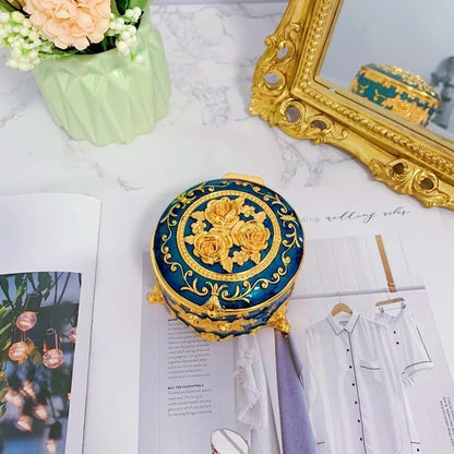 Elegant Blue Trinket Box showcasing a top view with intricate floral and leaf engravings on the lid