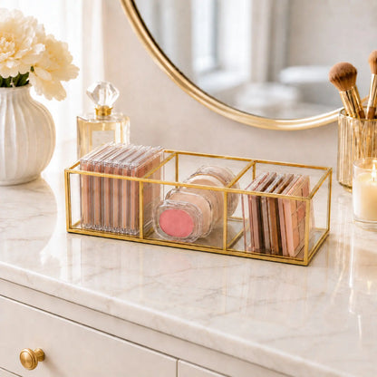 Gold Glass Makeup Organizer Box holding cosmetics on a vanity table with elegant display