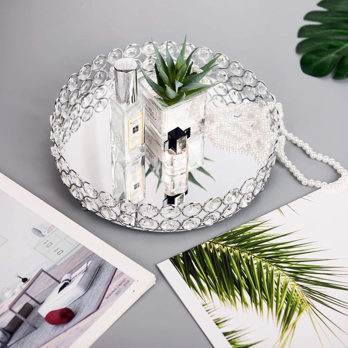 Decorative Crystal Makeup Organizer Tray displaying ornaments in a home setting, adding elegance to the space