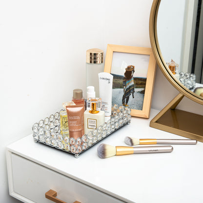 Organized Crystal Makeup Organizer Tray with cosmetics displayed beside a vanity, creating a tidy and stylish beauty space