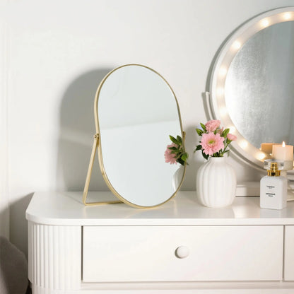 Feyarl Oval Vanity Mirror with Gold Frame on a Vanity Table for Stylish Makeup Space Display