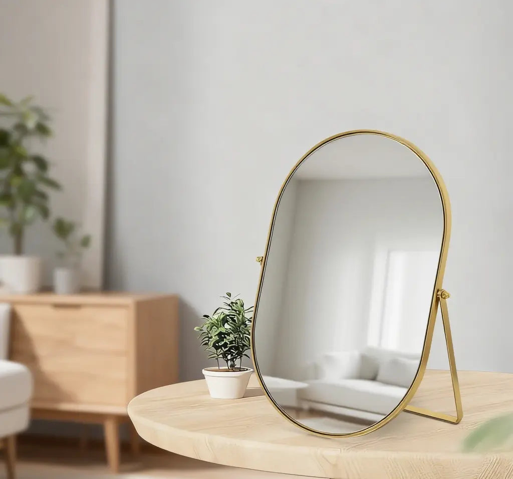 Feyarl Oval Vanity Mirror with Gold Frame on a Living Room Table for Stylish Home Decoration