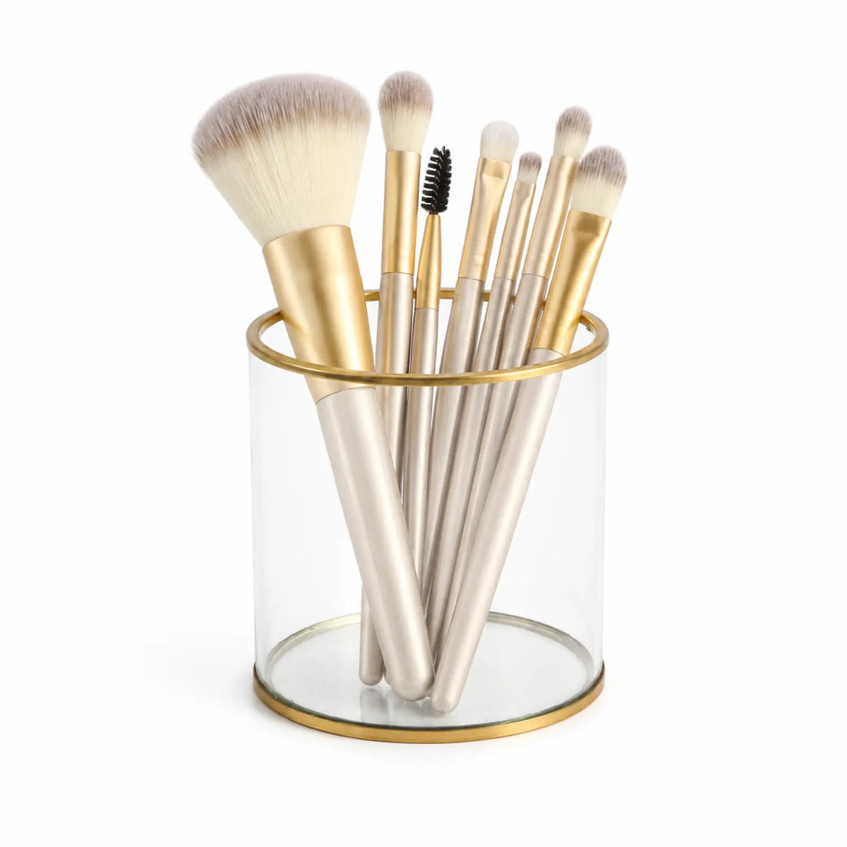 Gold Glass Storage Container holding makeup brushes with an elegant vanity display