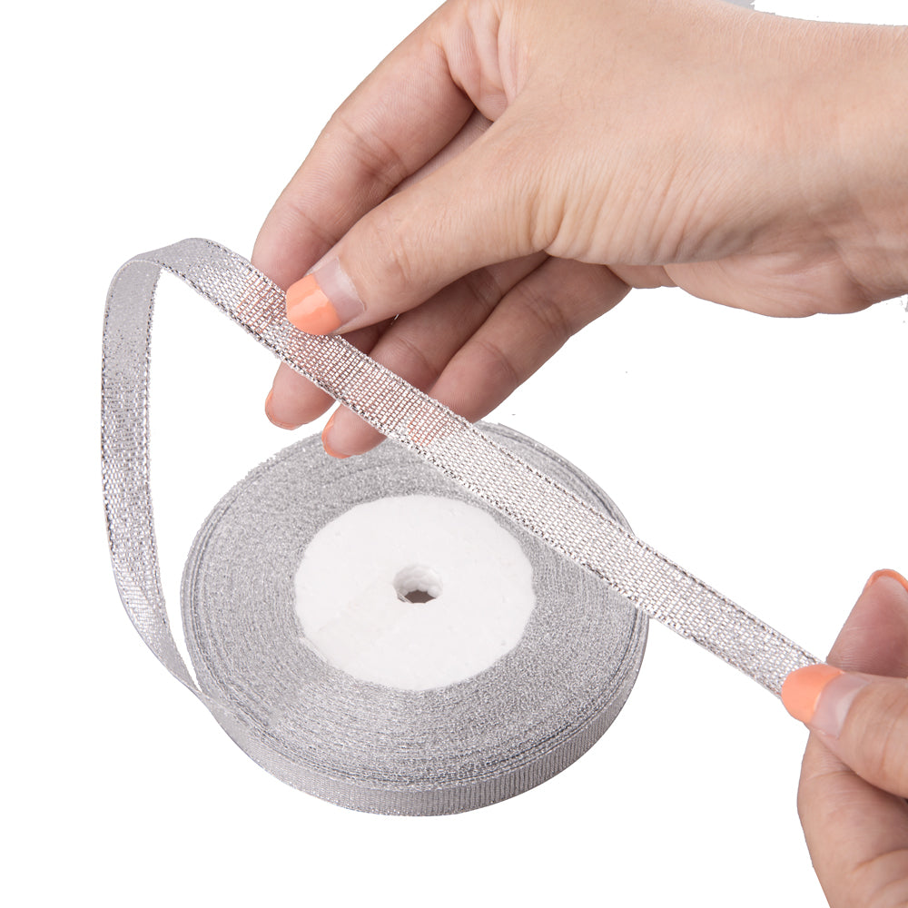 Feyarl Silver Glitter Ribbon Held in Hand, Showcasing Its Shimmering Texture and Elegant Metallic Finish