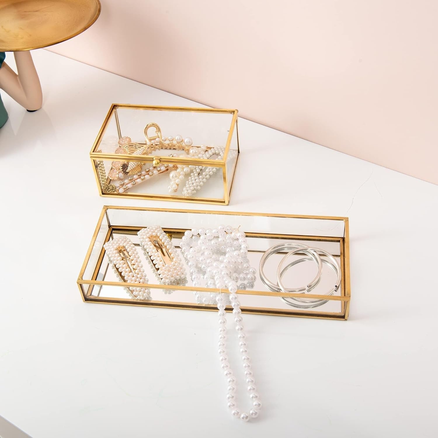 Gold Glass Organizer Box creating an organized tabletop space with a stylish clear glass design