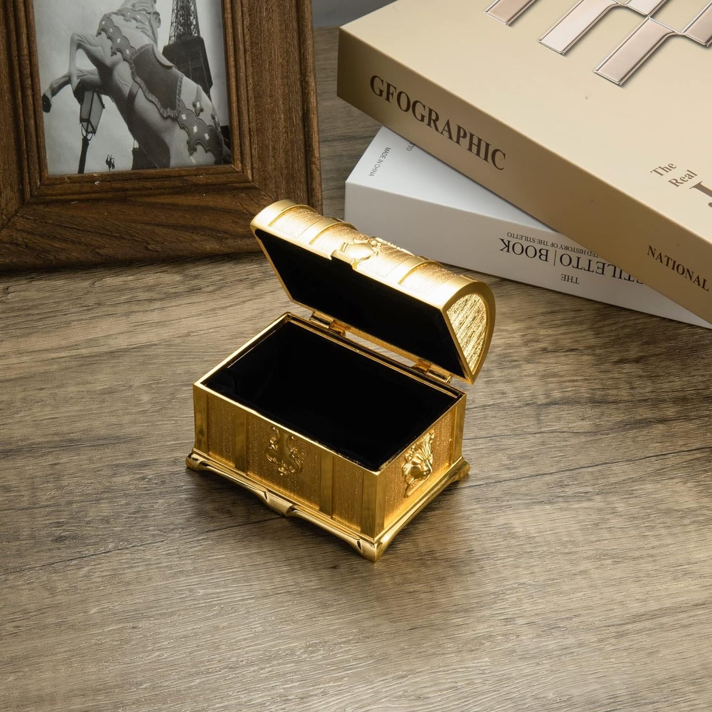 Elegant Vintage Treasure Box opened on a tabletop revealing its refined interior and antique decorative design