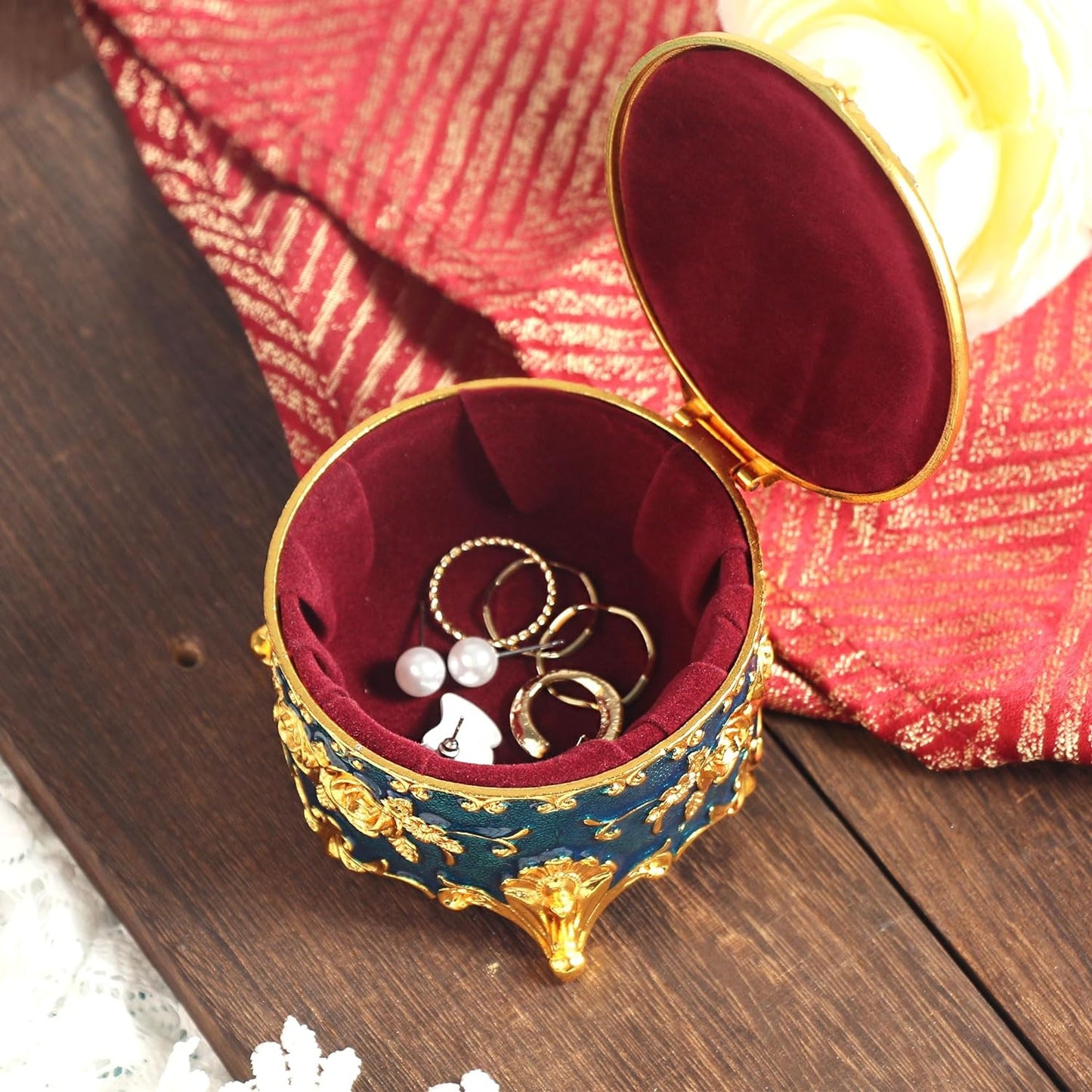 Compact Blue Jewelry Box opened with jewelry inside showcasing its velvet-lined interior and elegant storage design