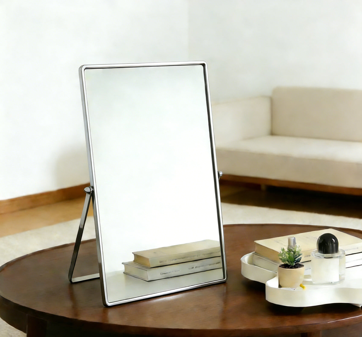 Silver Tabletop Vanity Mirror Displayed on a Small Side Table as a Stylish Decorative and Functional Accent