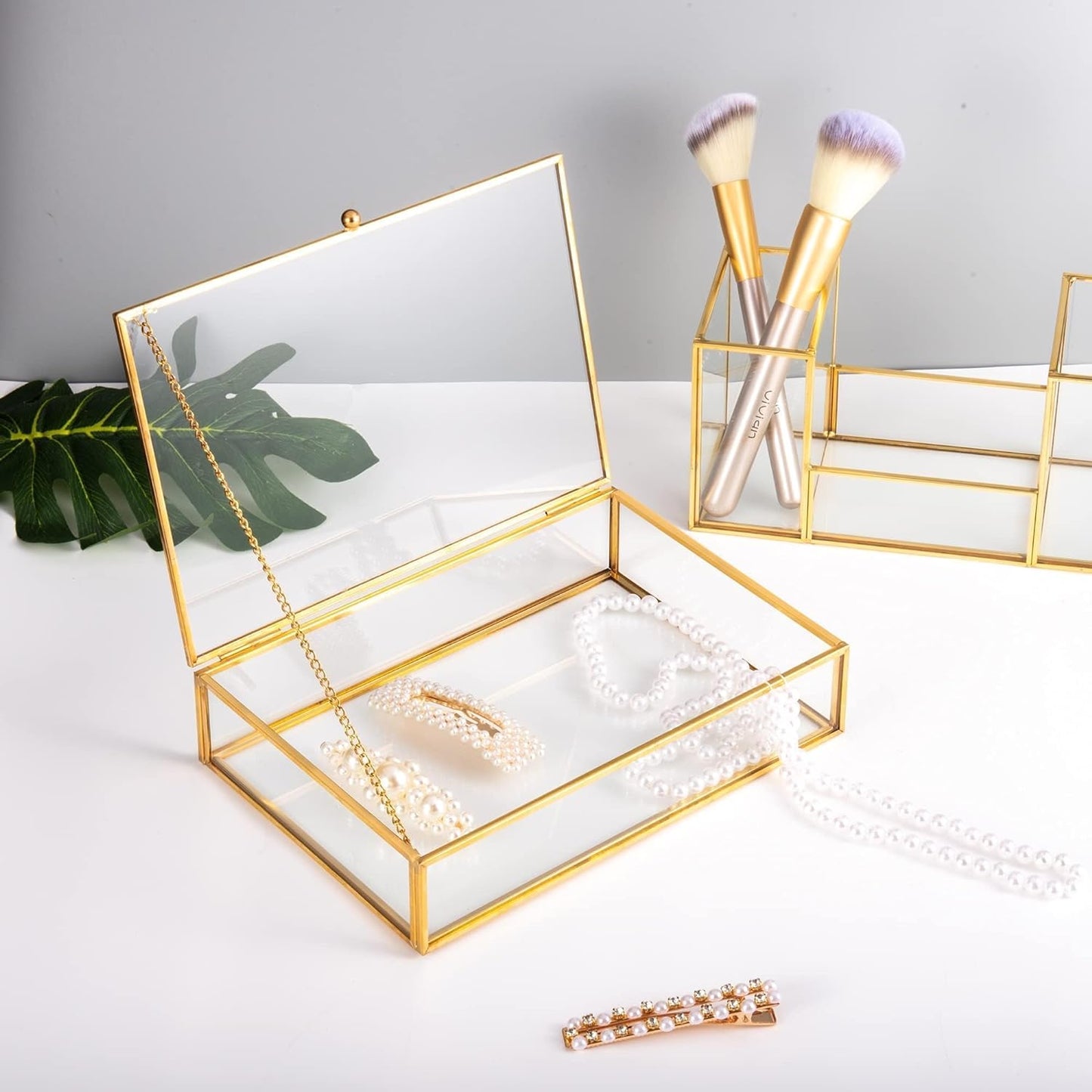 Gold Clear Glass Vanity Organizer with jewelry creating a stylish and organized vanity space
