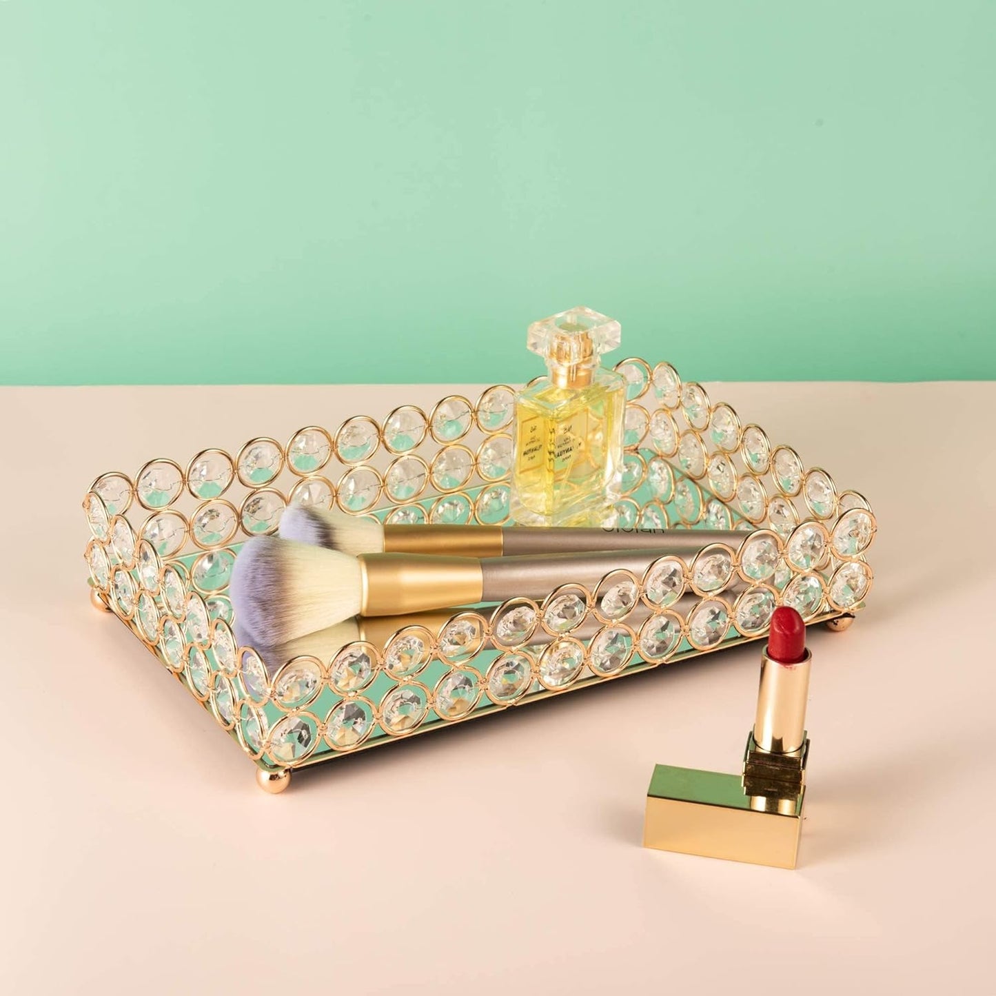 Reflective Crystal Vanity Tray with makeup essentials, featuring a mirrored surface that enhances the beauty of displayed items