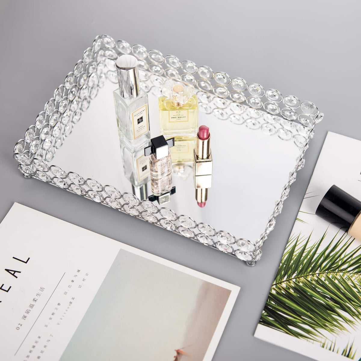Elegant Crystal Vanity Tray with perfume and makeup products displayed, enhancing a refined indoor beauty space