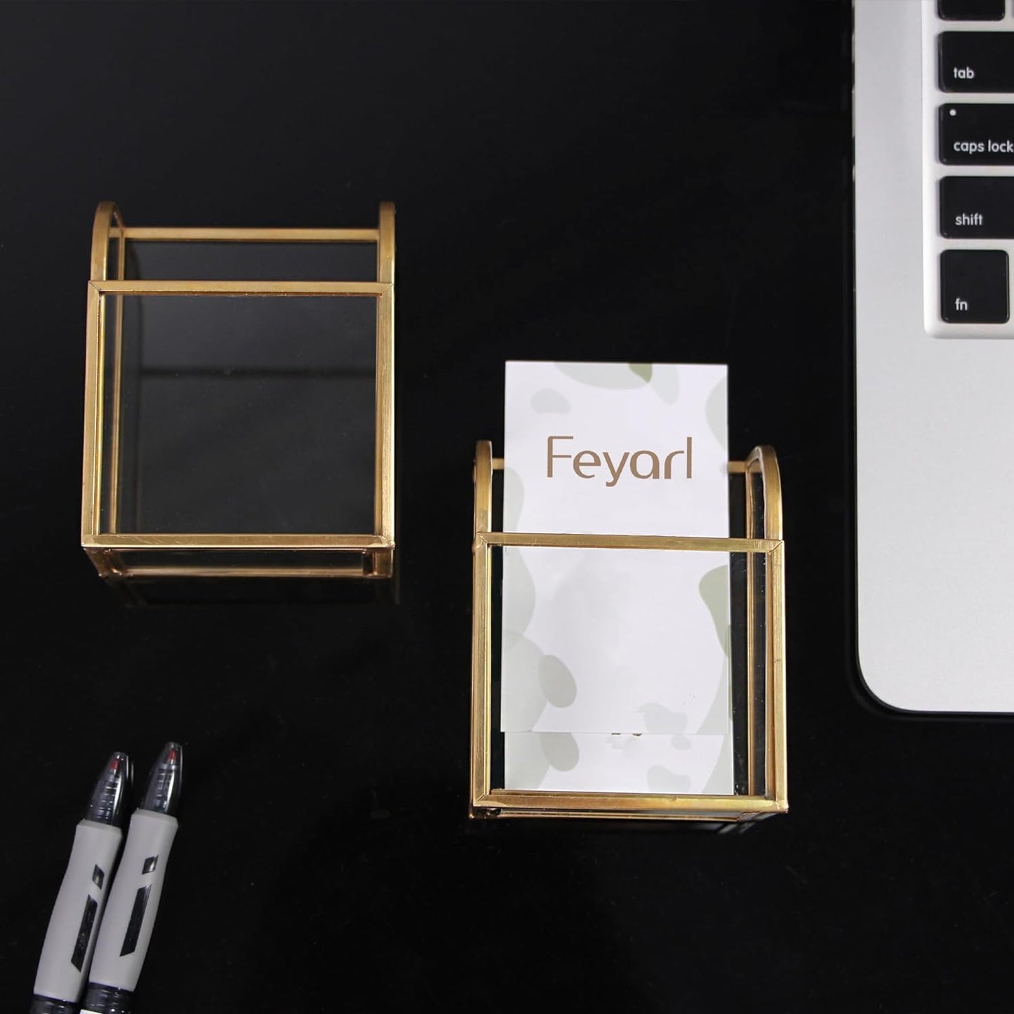 Business Card Holder with gold edge lying beside a computer, holding name cards for easy access