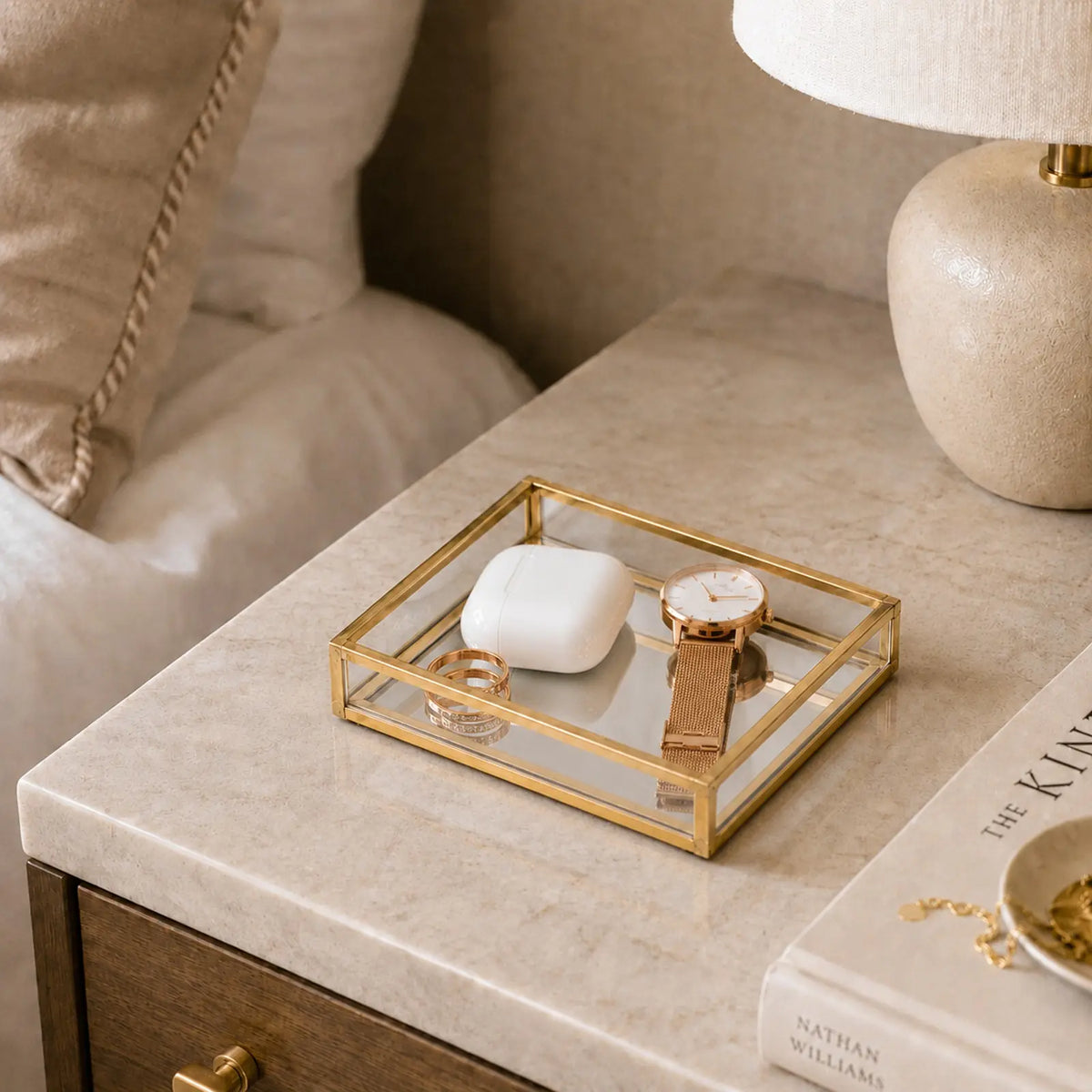 Glass Watch Tray displaying a watch and earbuds on a nightstand for elegant everyday organization