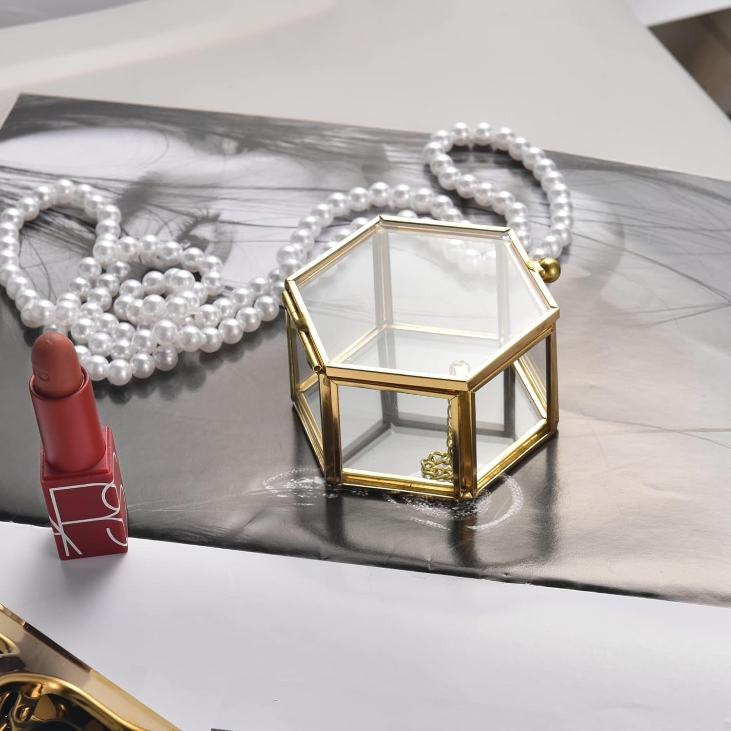 Elegant gold glass jewelry box on vanity dresser